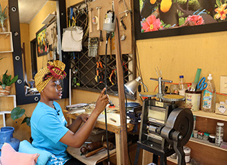 Photo of a woman working. Link to Life Stage Gift Planner Ages 60-70 Situations.